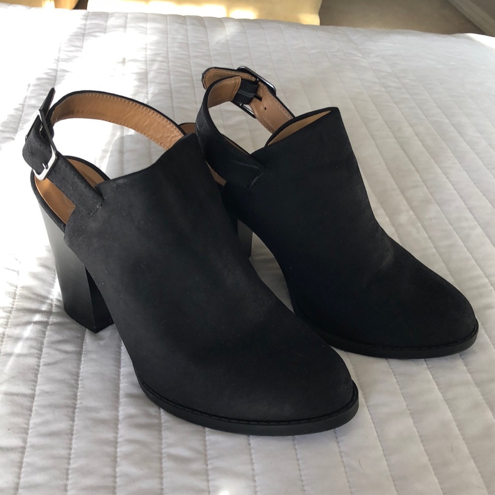 Silver buckled black booties